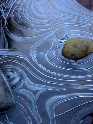 Illustration for article titled What Caused These Rings of Ice to Form Around Rocks?
